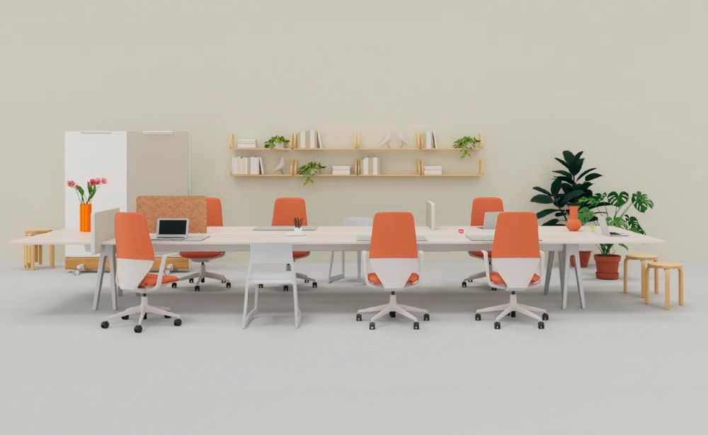 Vitra Möbel Büroszene mit grossem weissen Tisch, sechs Bürostühlen sowie weiteren Sitzgelegenheiten.